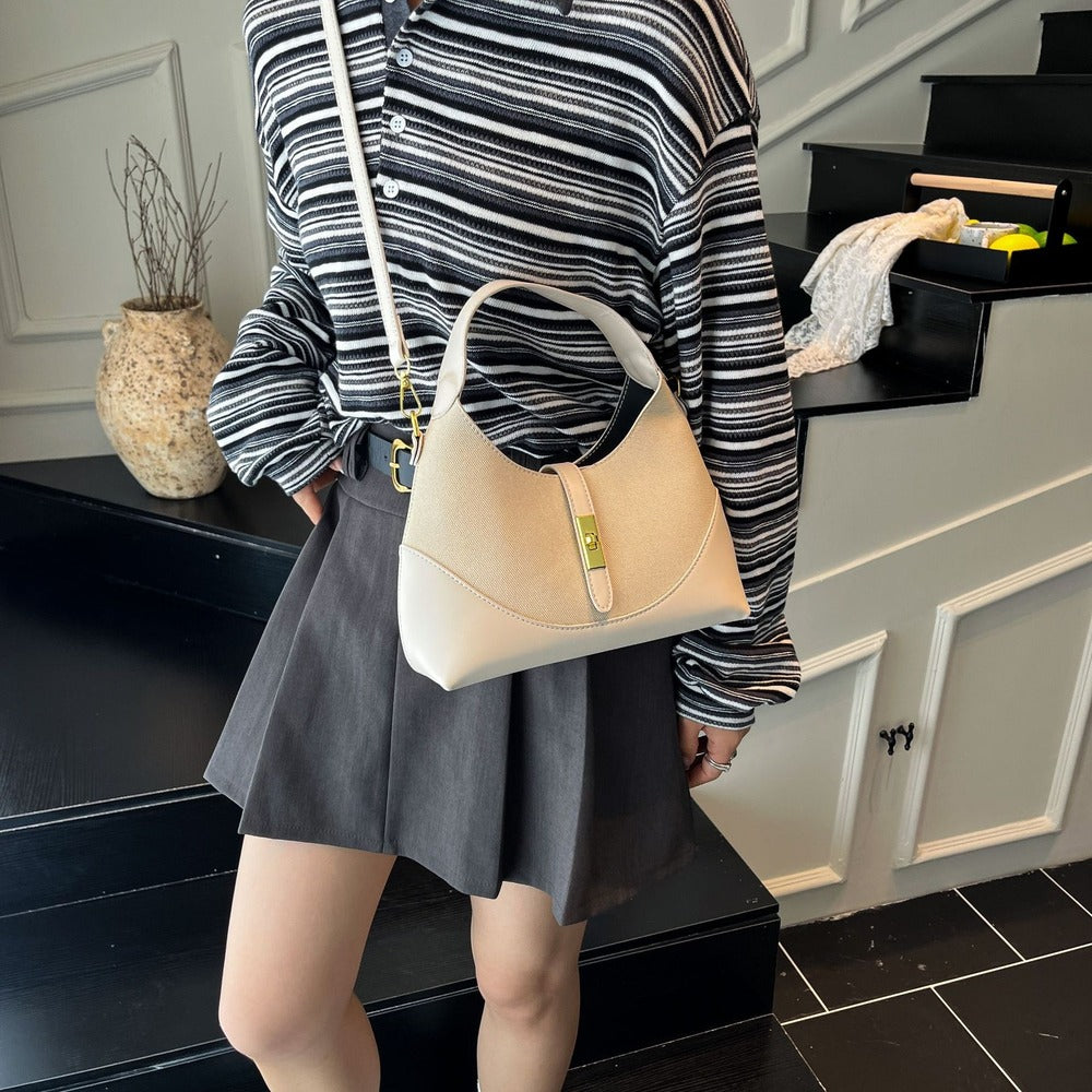 White crescent hobo bag worn crossbody