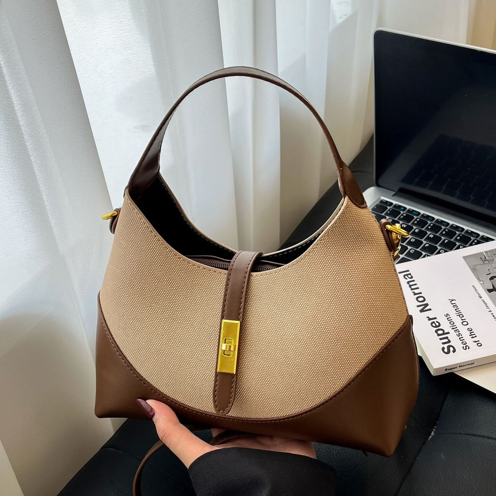 Coffee hobo shoulder bag held by the curved handle