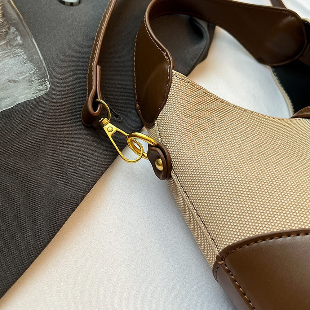 Gold-tone clasp attaching the detachable strap