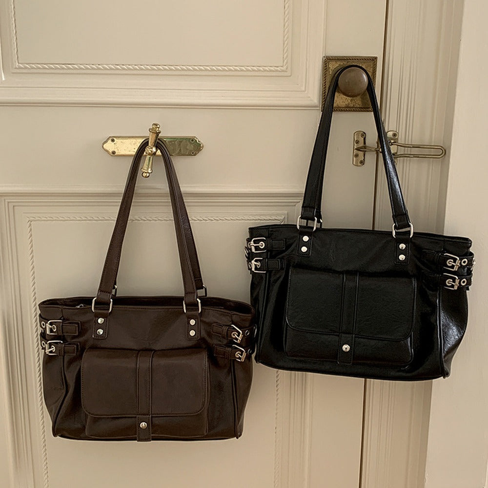 Coffee brown and black buckle tote bags side by side