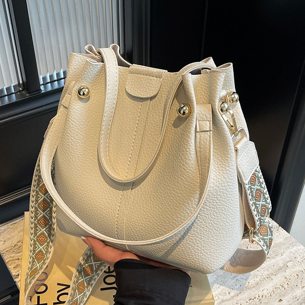 Cream bucket bag with jacquard guitar strap