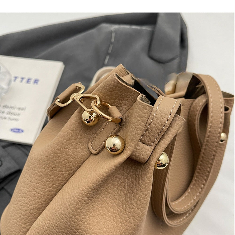 Gold-tone hardware and strap clip detail