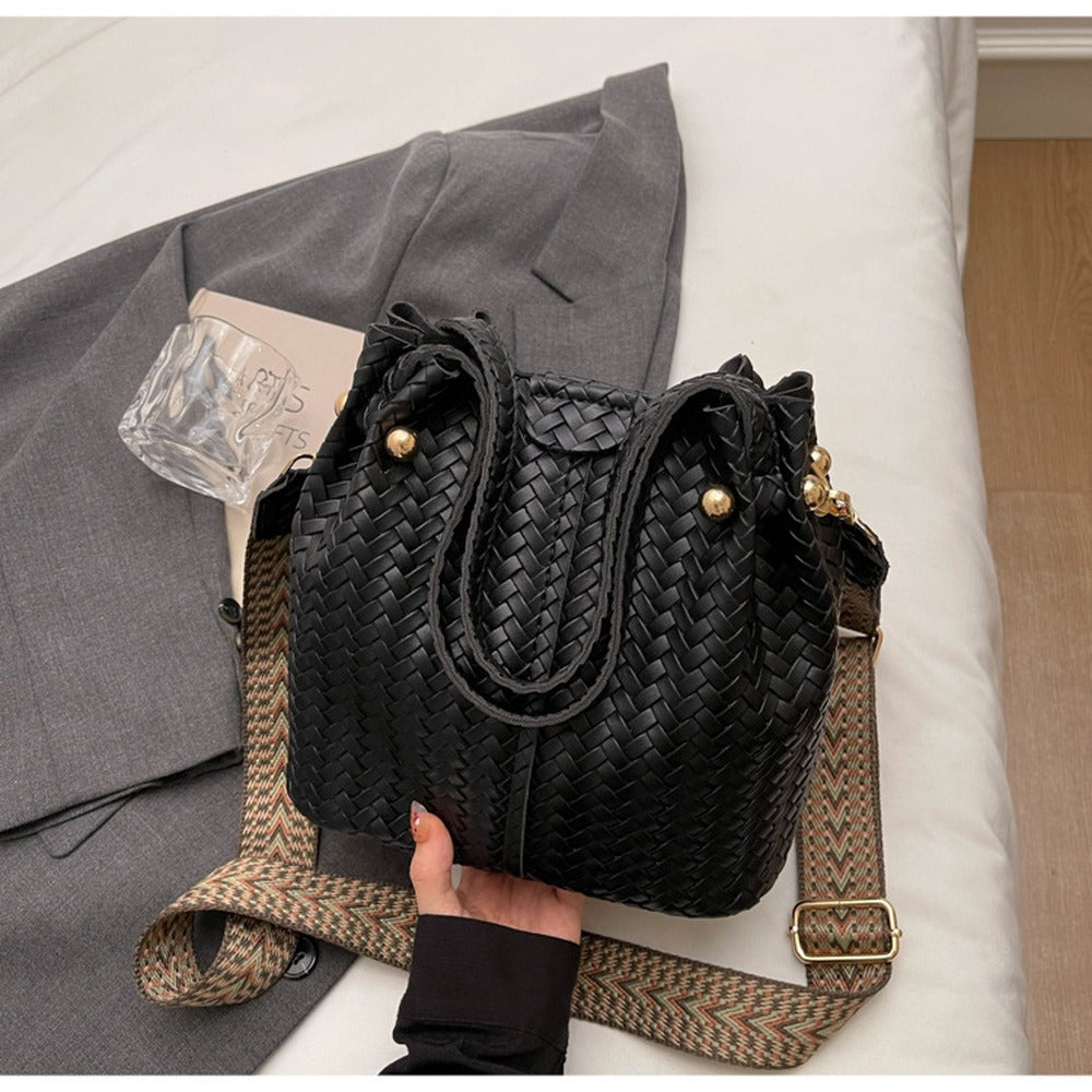 Woven Black bucket bag with top handles and wide crossbody strap
